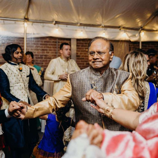 older indian man dancing at wedding
