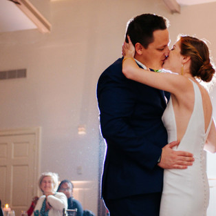 bride and groom kiss during first dance