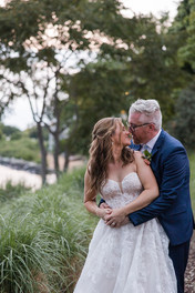 bride and groom about to kiss during golden hour