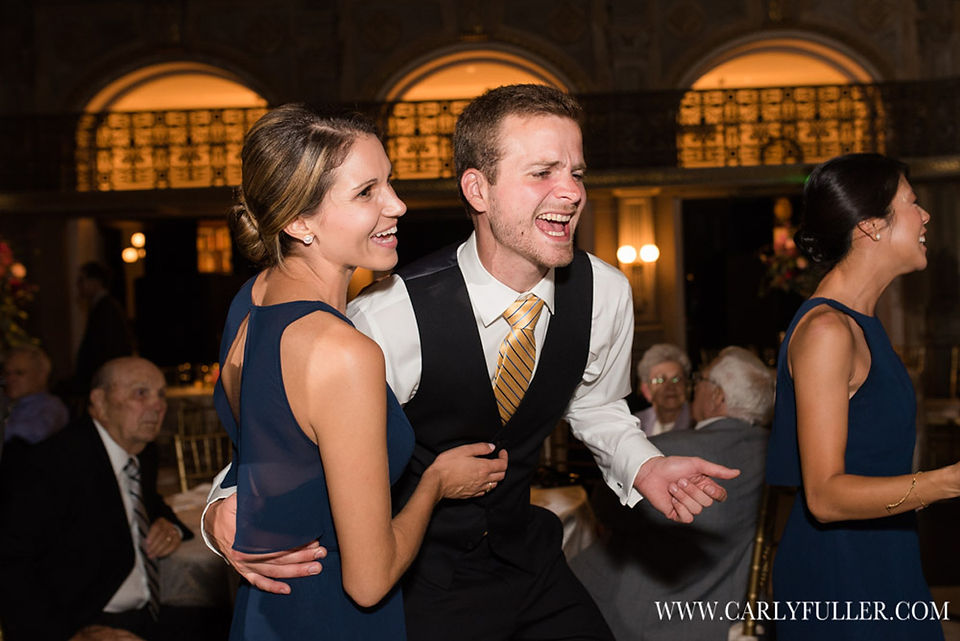 man and woman dancing at wedding