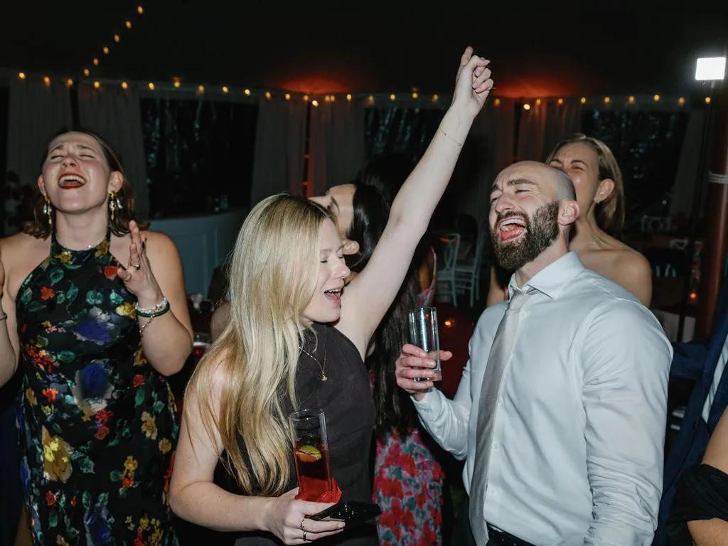 woman dancing with arm up