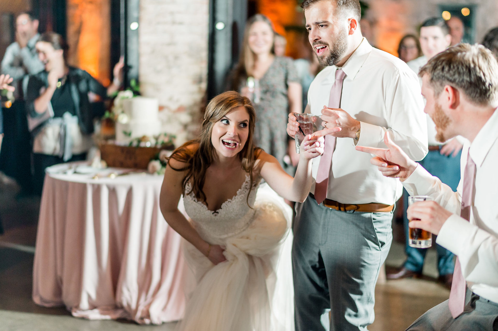 bride smiling at groomsman