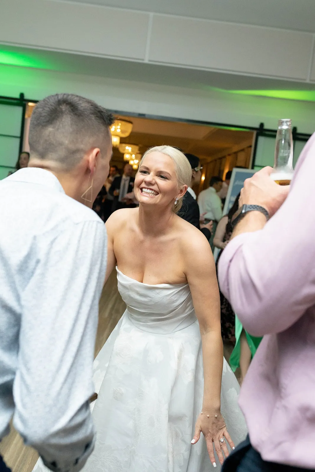 bride dancing and smiling at wedding