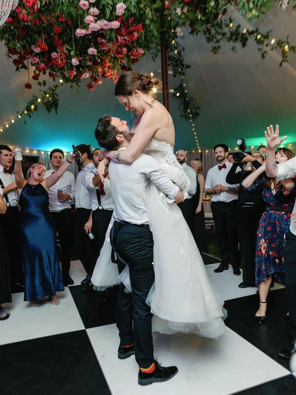 groom lifting bride up