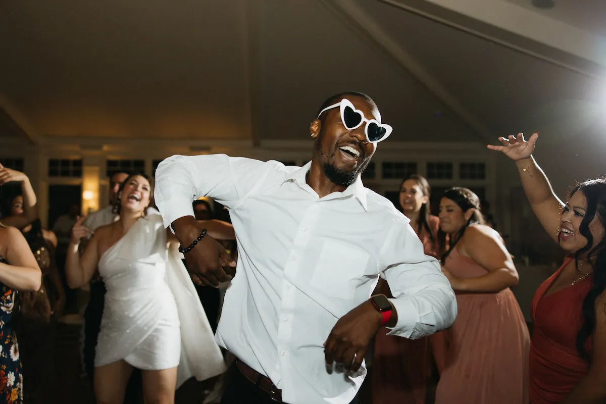 dj dancing with sunglasses on 