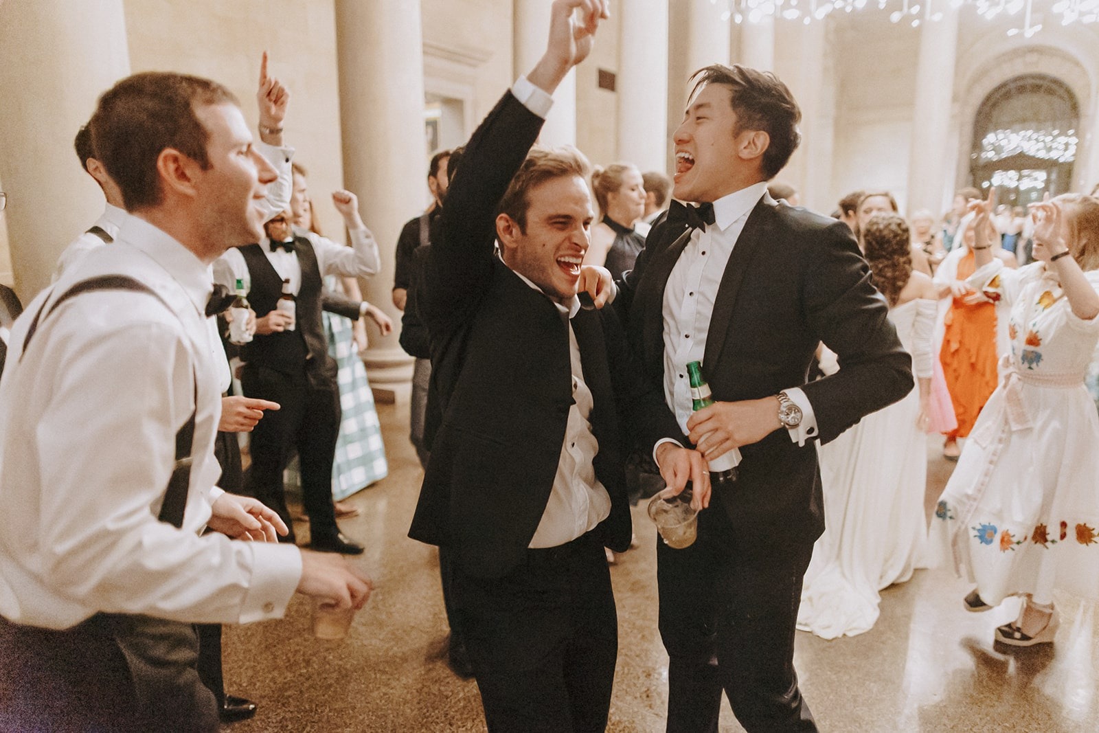 groom and guys dance at wedding