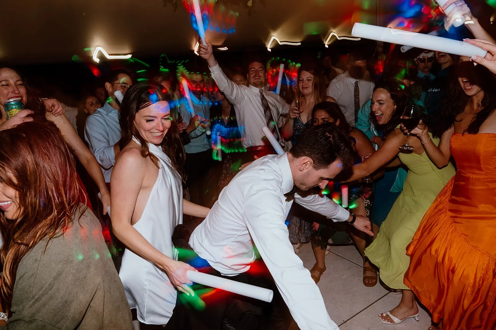 groom dancing in front of bride