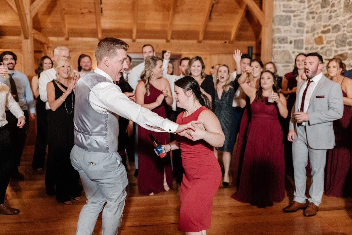 guy and woman in red dress dancing