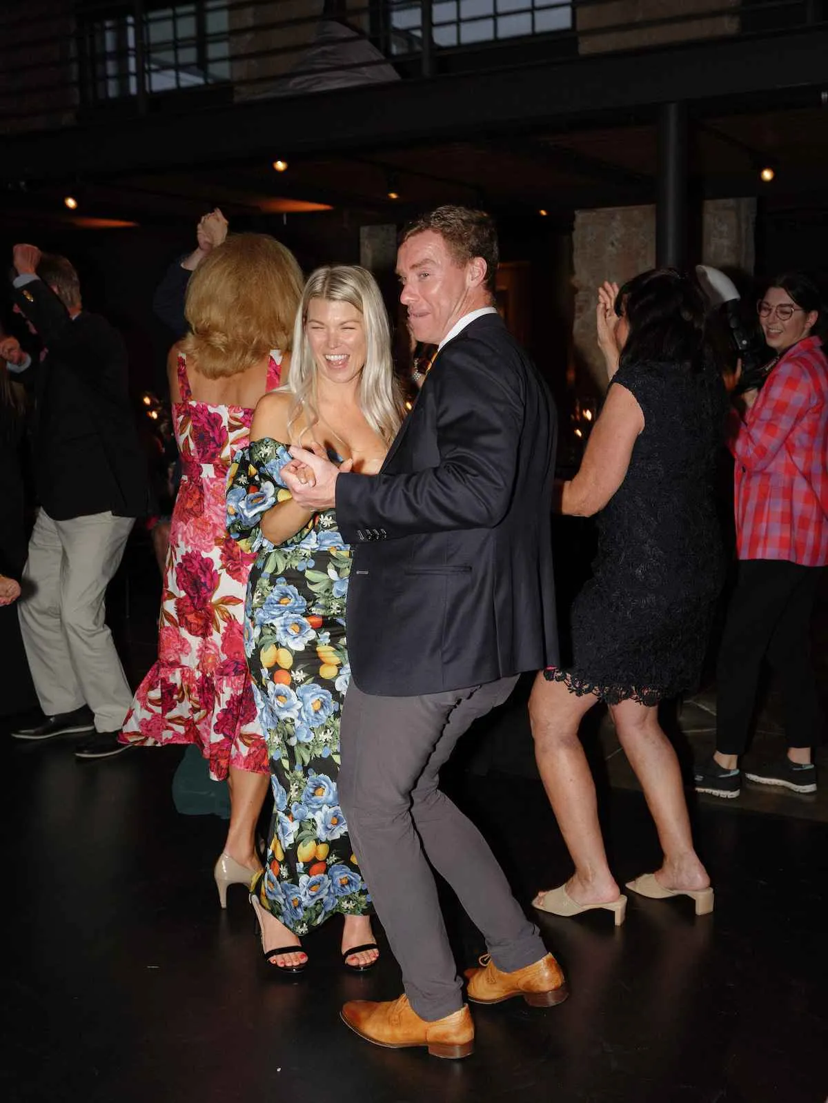 man and woman slow dancing at wedding