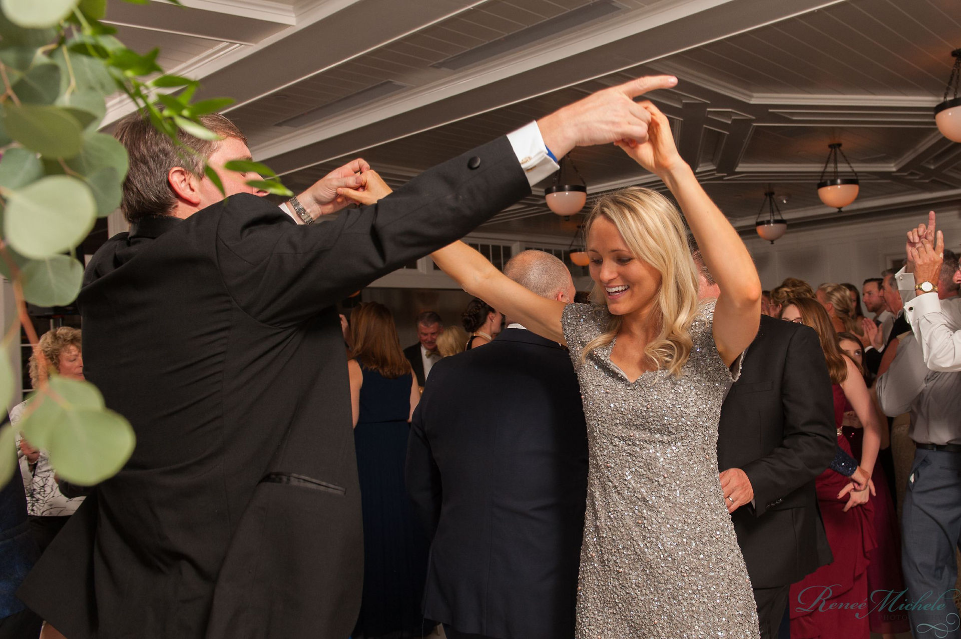 man and woman dancing at wedding