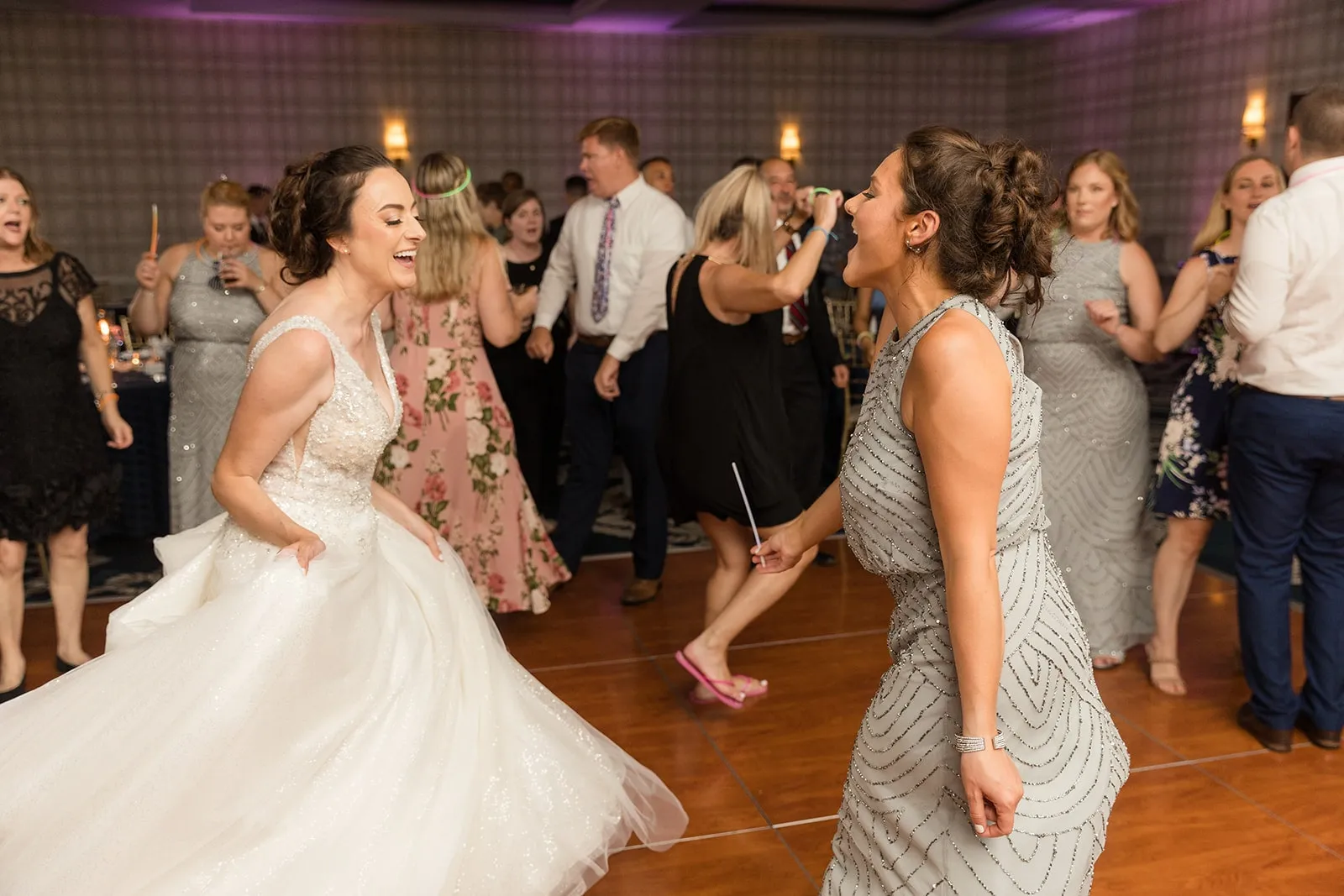 bride dancing with bridesmaid