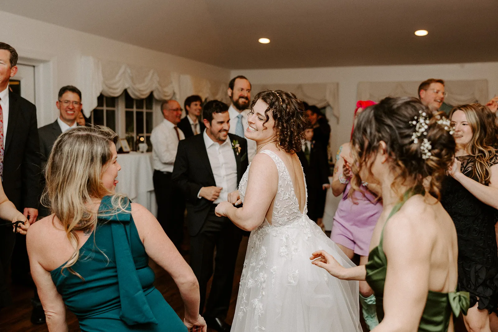 bride dancing with guests
