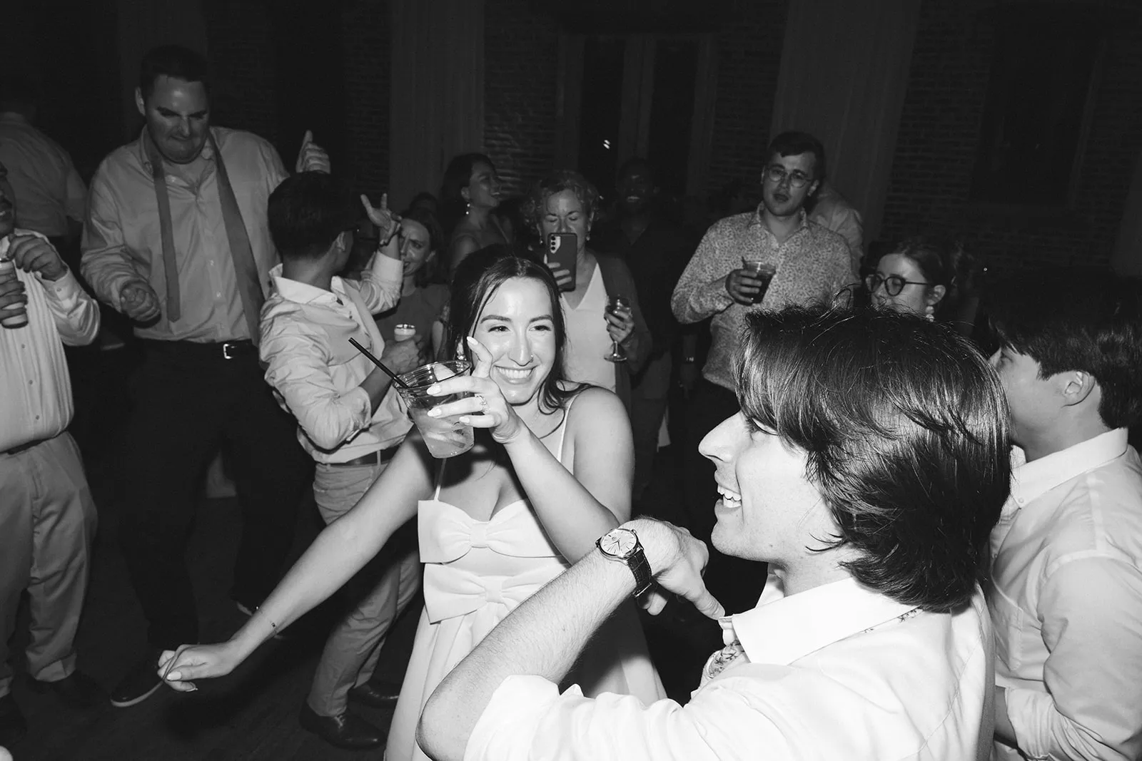 bride and groom dancing with guests