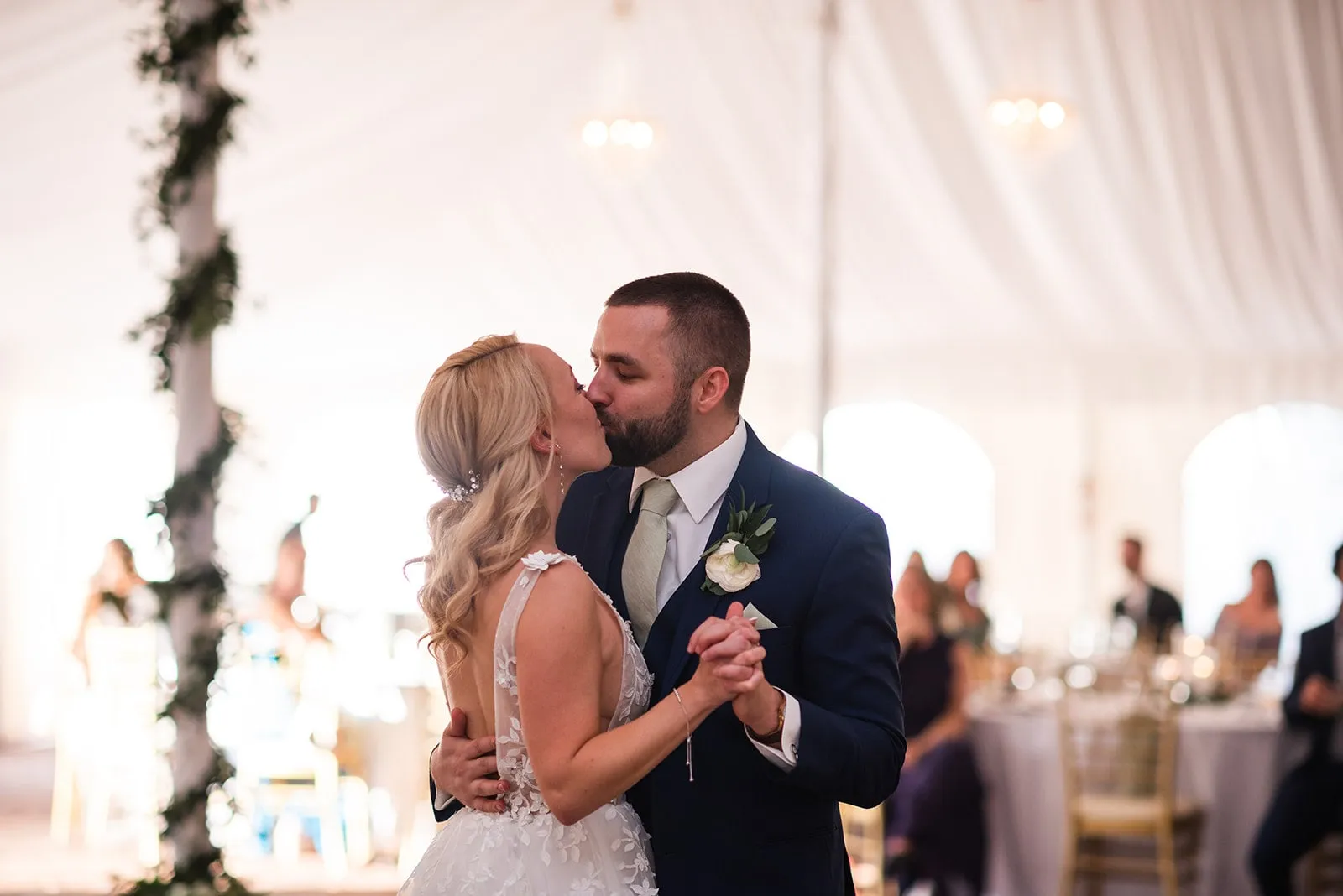 bride and groom kiss during first dance