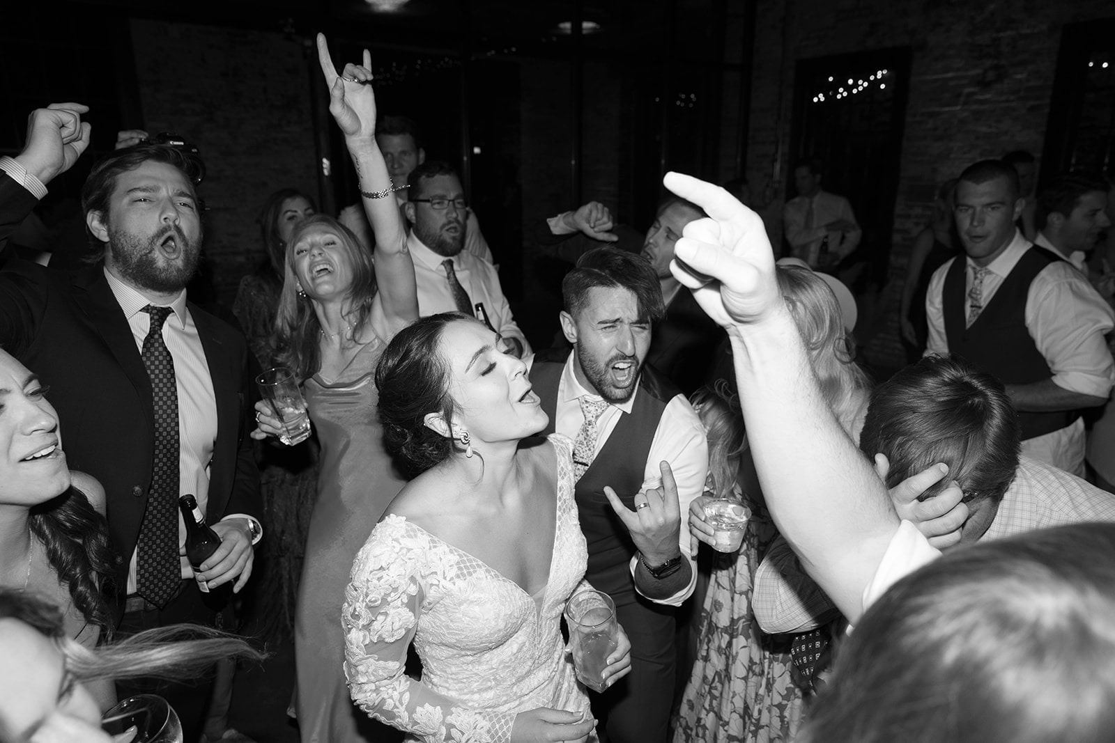 bride and guests dancing at wedding