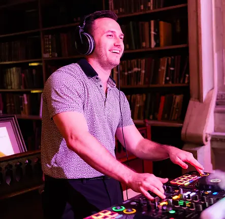 DJ Ross mixing music at private event
