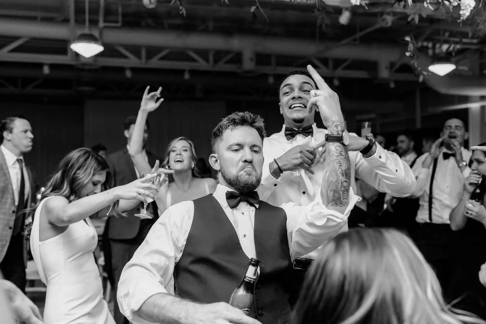 groomsmen dancing at wedding