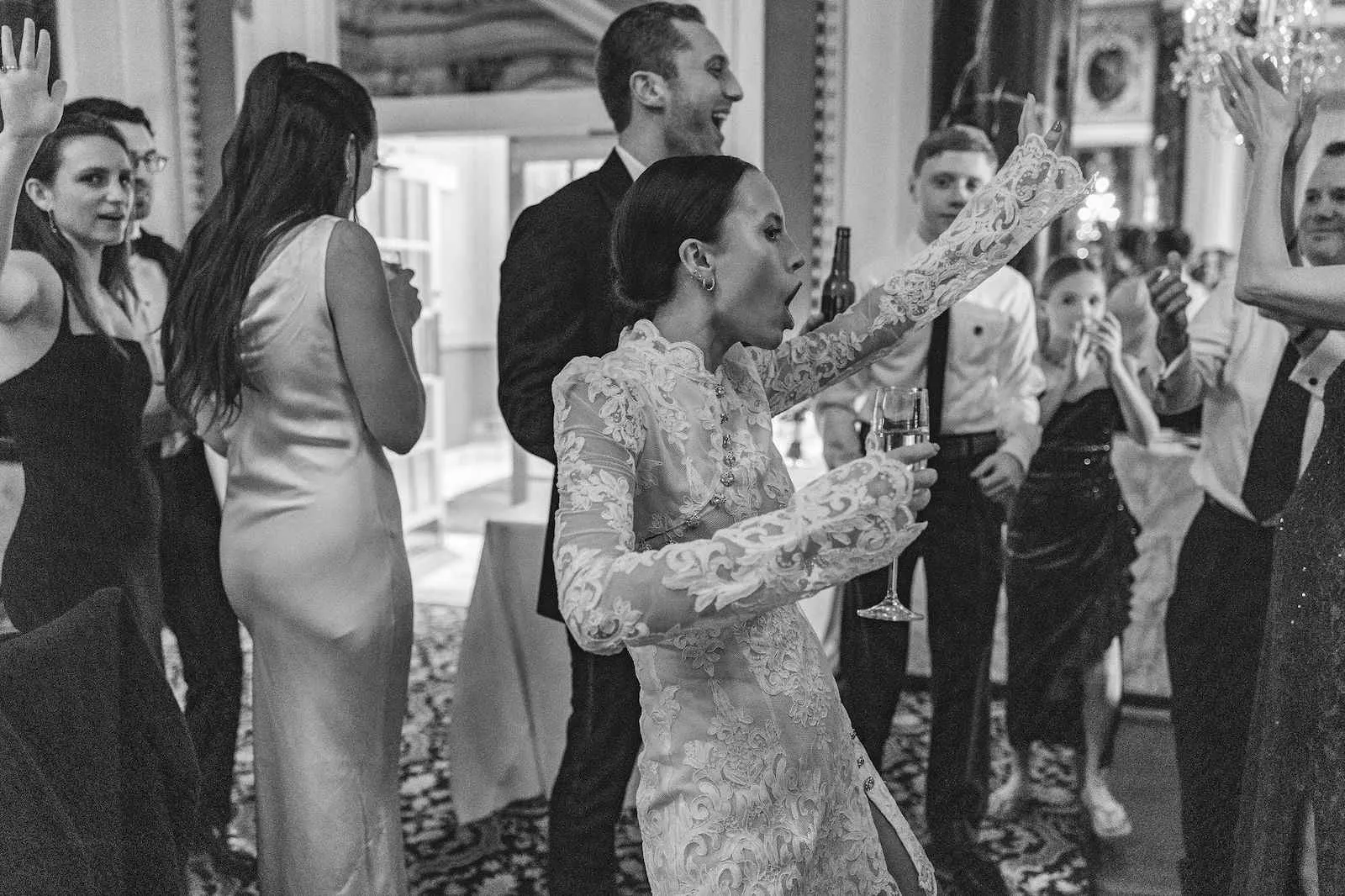 bride dancing with wine glass in hand