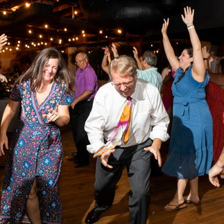 old guy and woman dancing at wedding