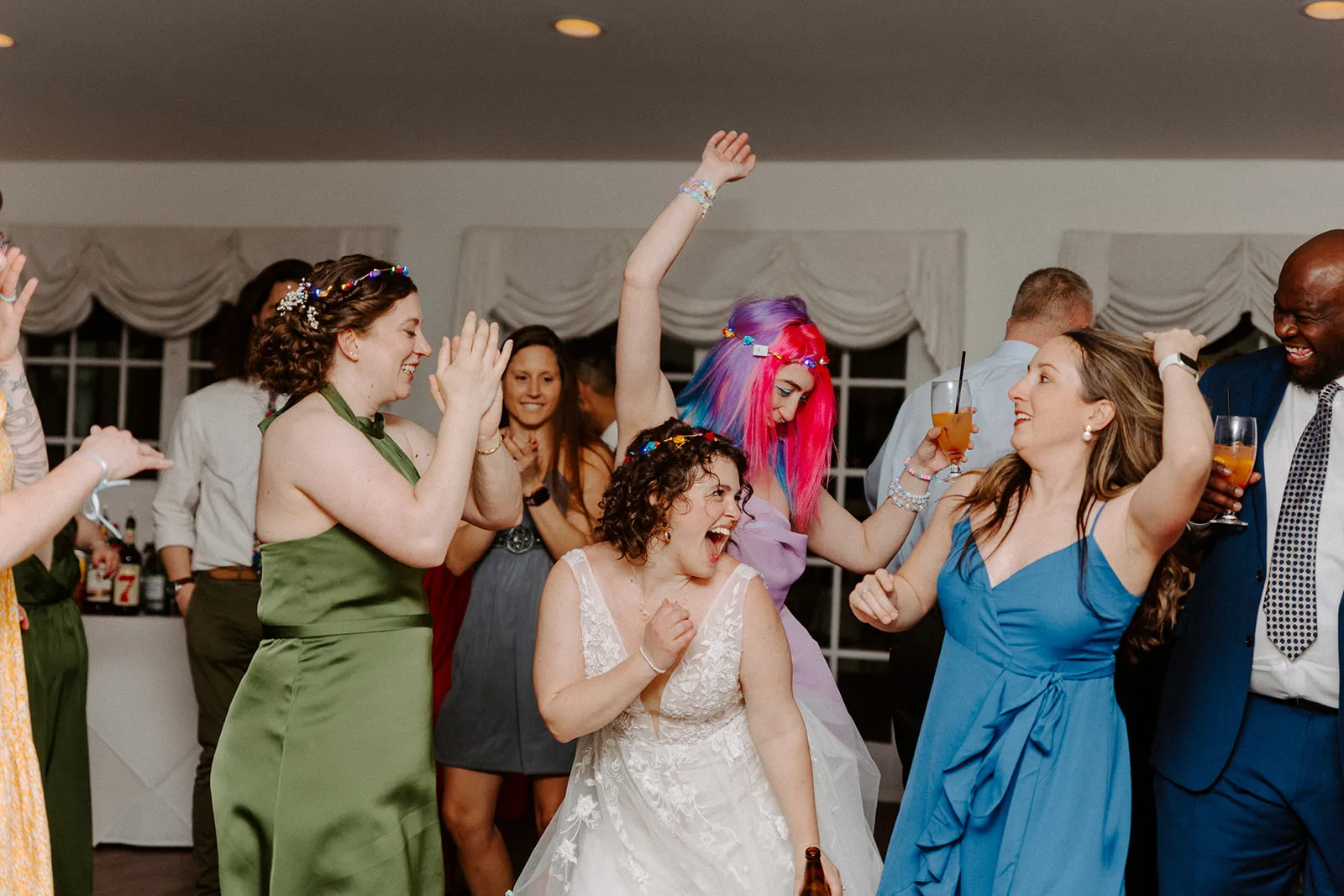bride dancing with women
