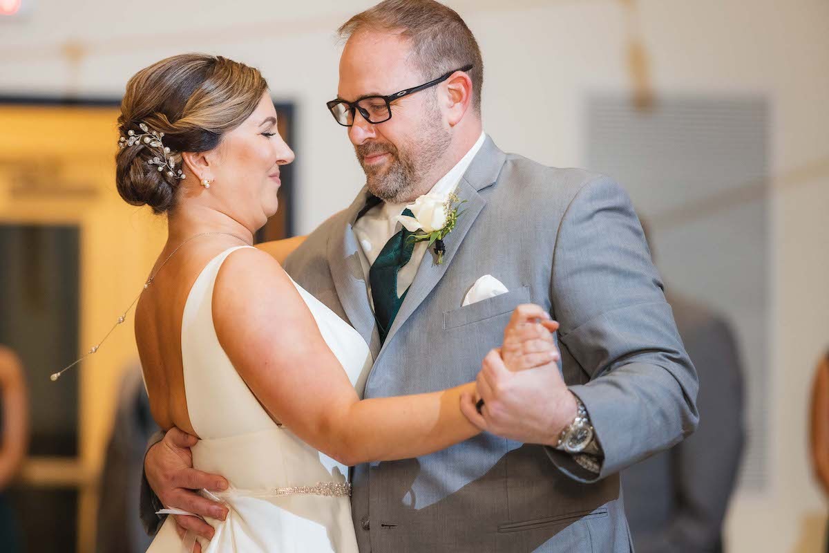 bride and groom dancing together