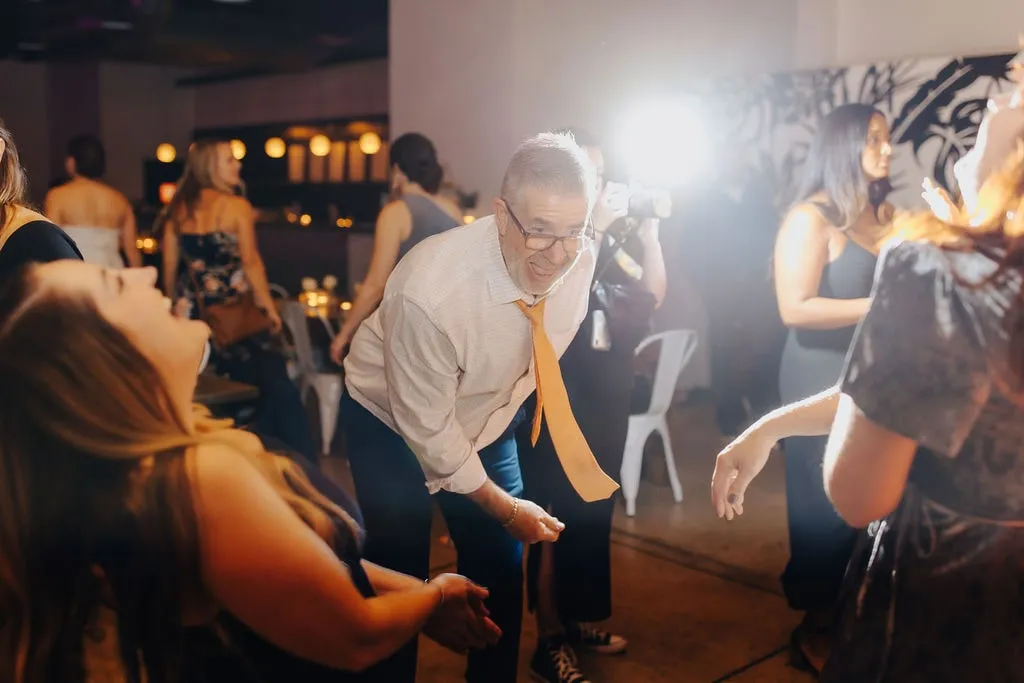 older man dancing at wedding