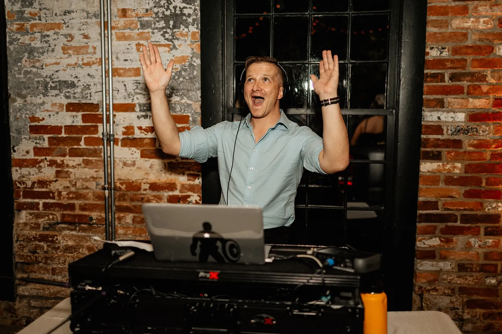 dj spins music with hands up