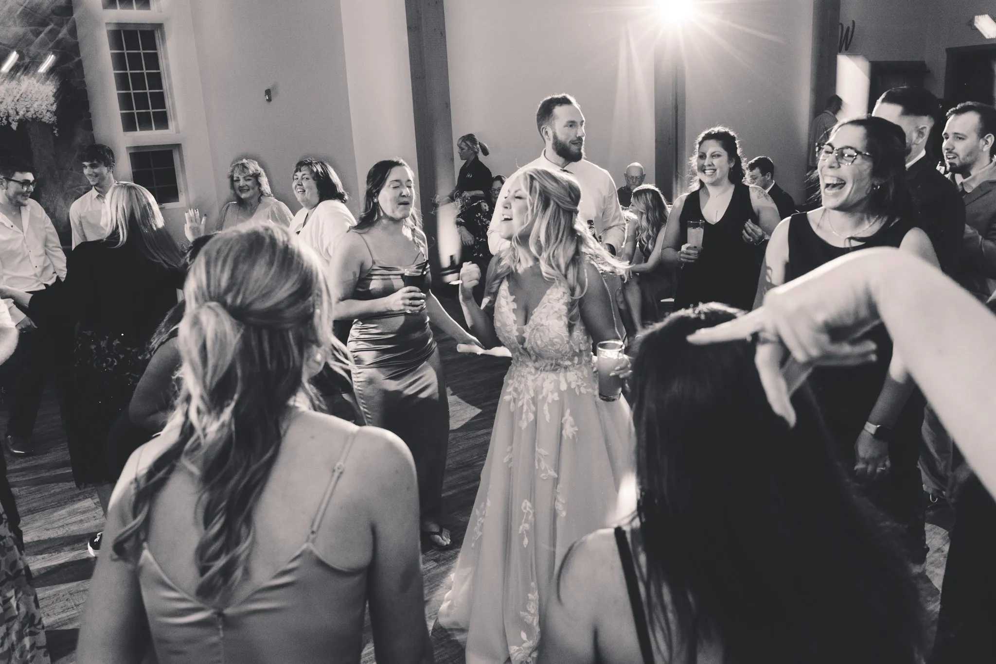 bride dancing with women