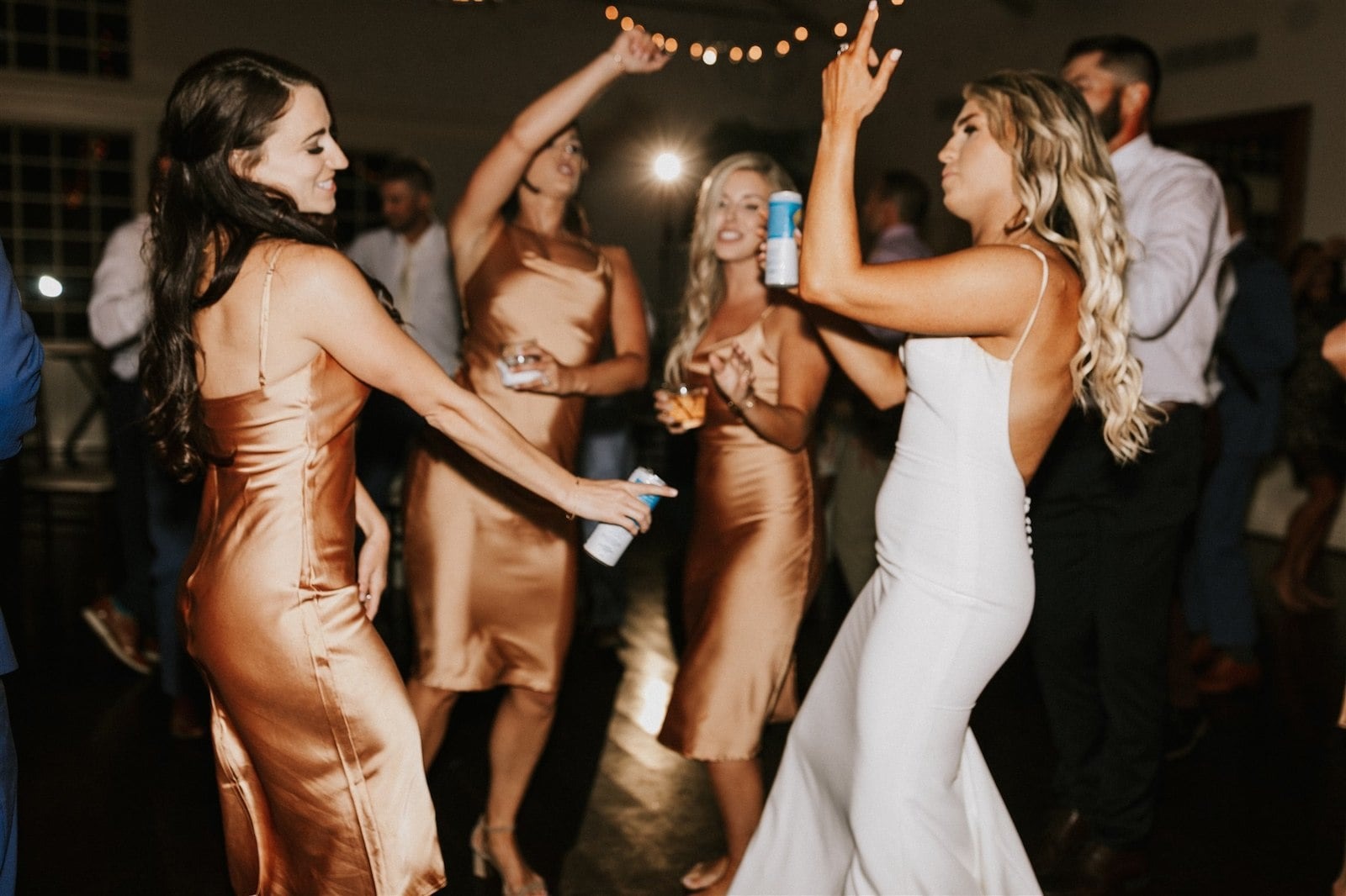bride and bridesmaids dance