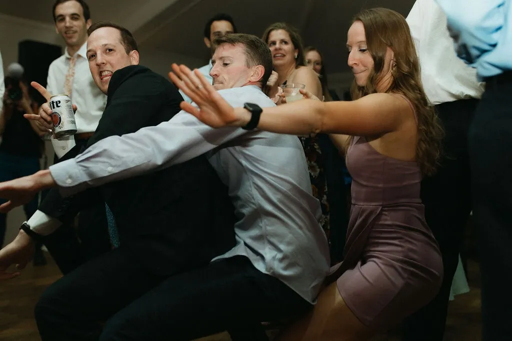 guests dancing low at wedding