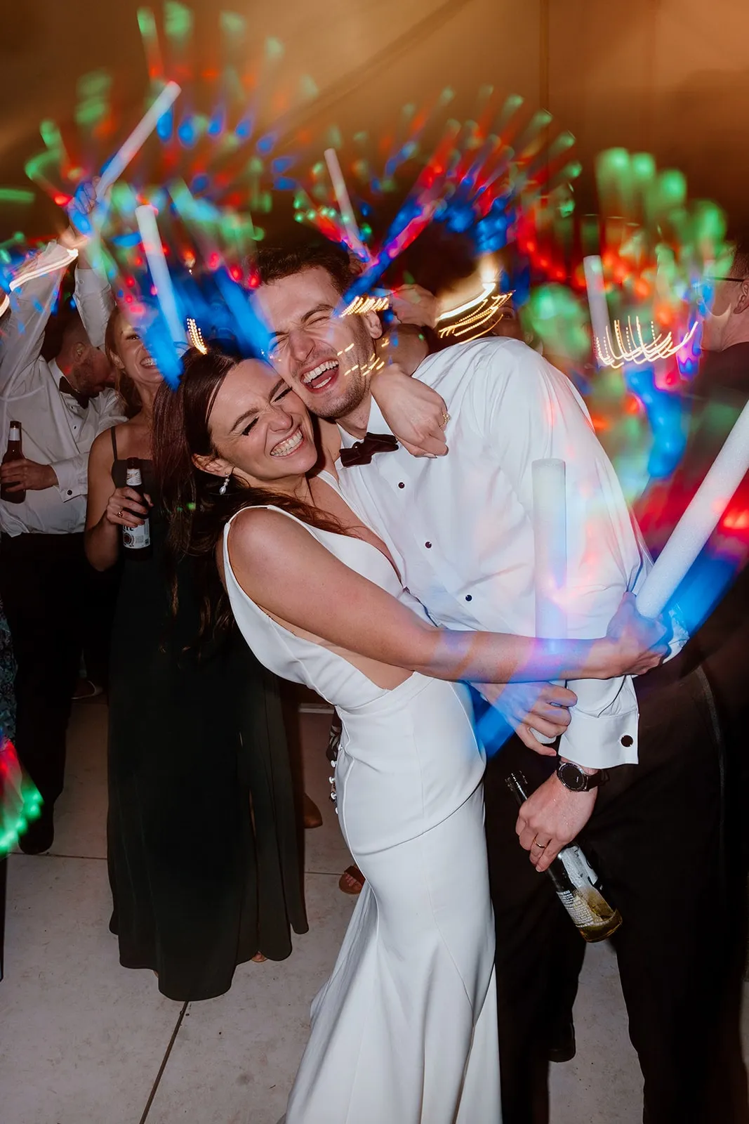 bride and groom smiling and posing on the dance floor