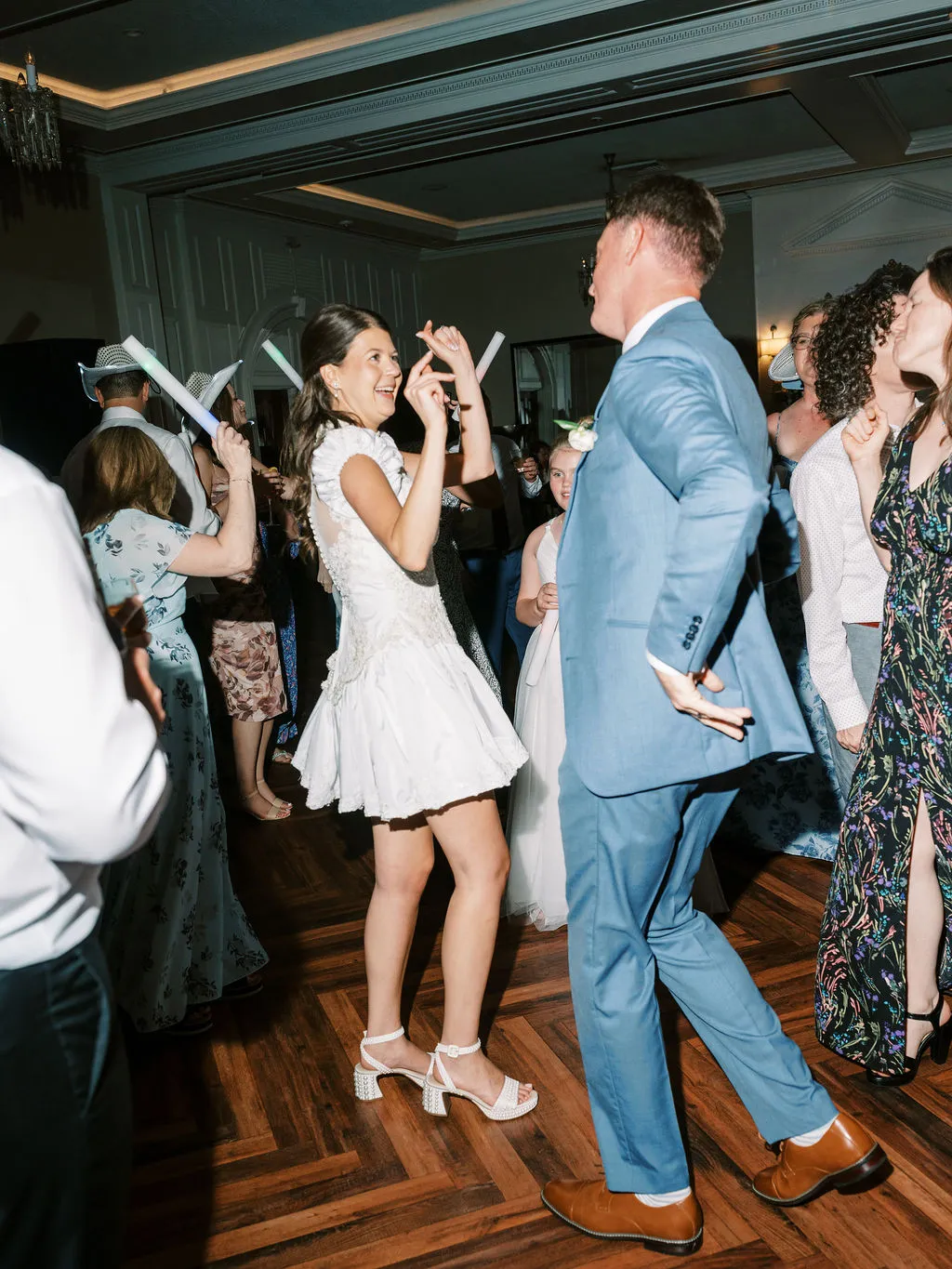 bride and groom dancing with guests