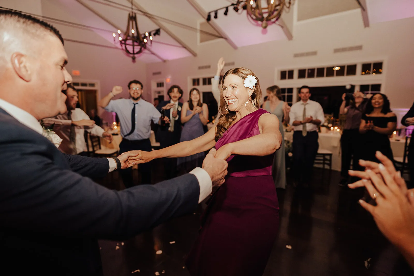 woman dancing with guy at wedding