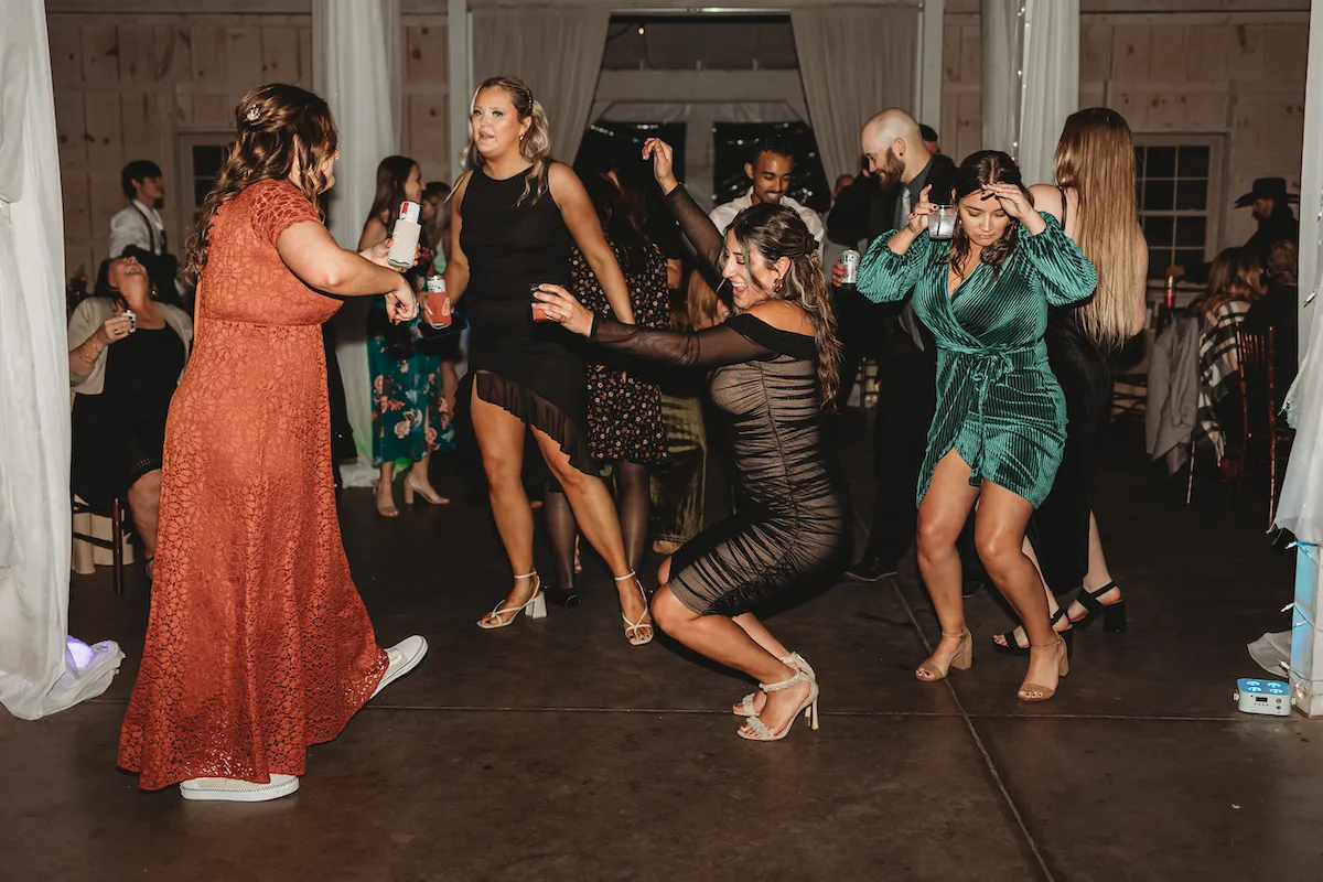 women dancing low at wedding