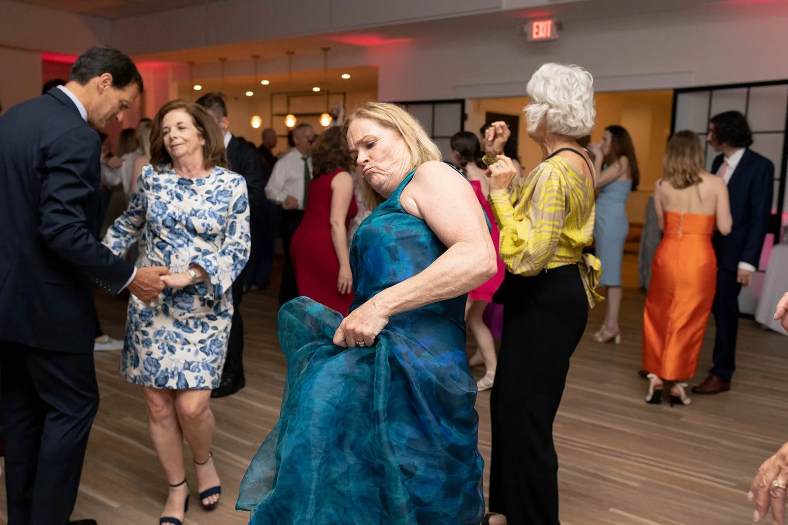 woman in blue dress dancing at wedding