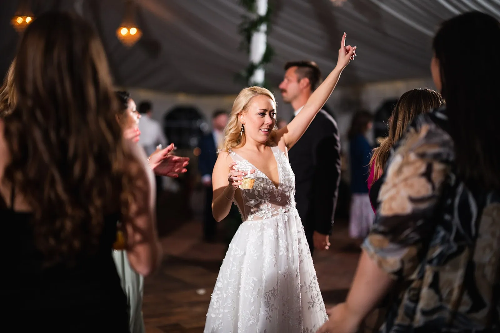 bride dancing with hand up