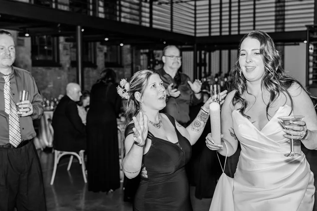 woman dancing with bride