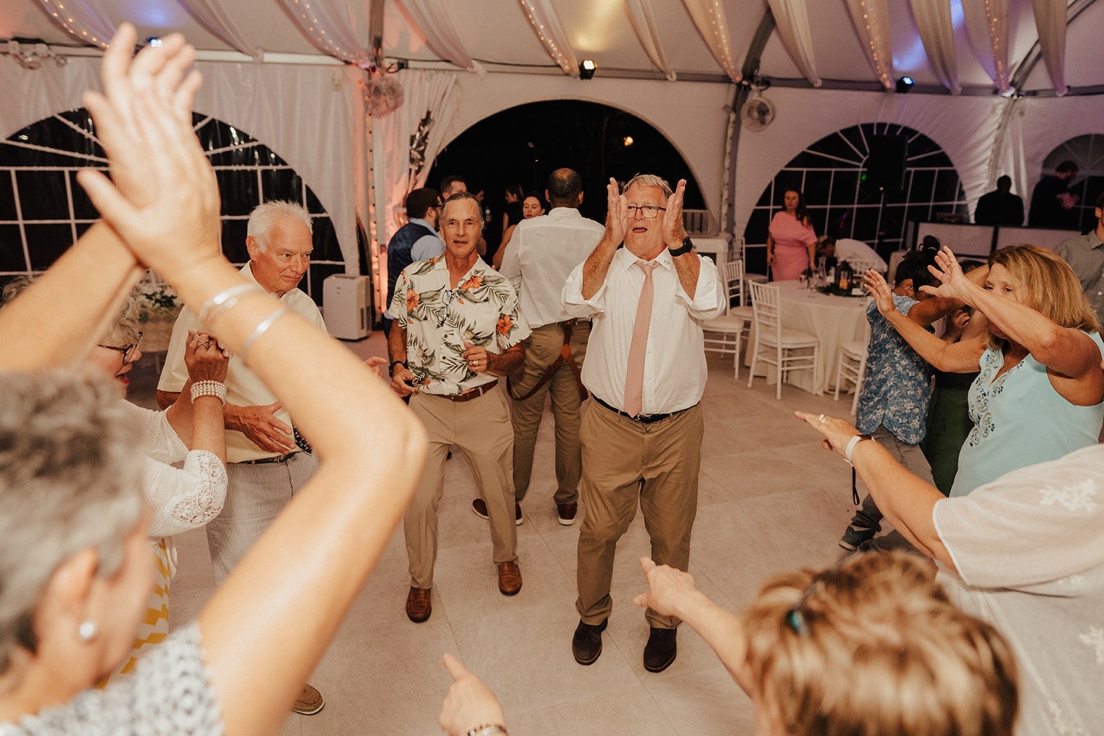 older guests dancing together at wedding