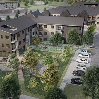 Exterior of MidCity Commons, a modern 3‑story apartment community in Bentonville, AR