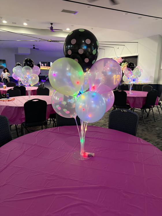 balloon centerpiece on a table at the beaver pool house