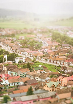 Scenic village overview: traditional houses, green fields