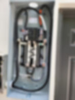 Open electrical panel with main breaker and wiring.