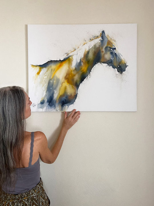 Artist standing beside the original painting Presence, showing the artwork’s scale.