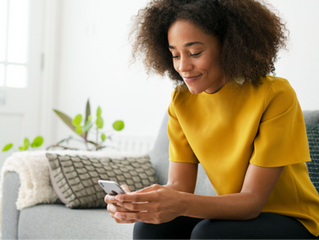 woman looking down at phone