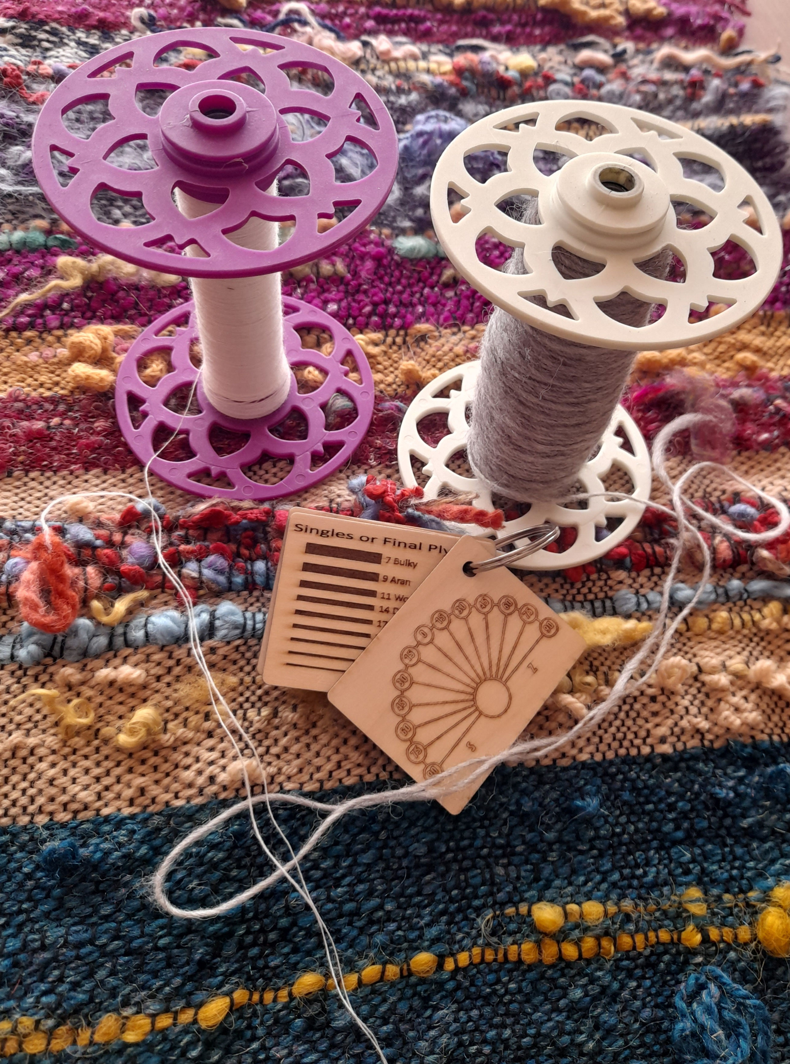 The Spinning Barn Hand Spinning Studio Logo with Spinning Wheel