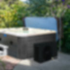 Energi Heat Pump next to hot tub in garden
