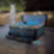 Reef Spas Maluku hot tub in a garden