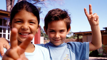 kids give peace signs