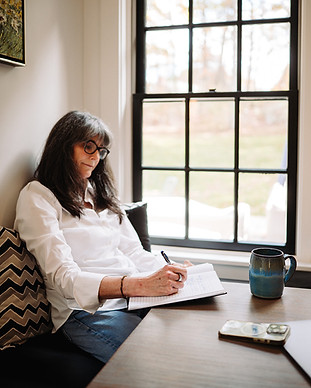Seana Williamson Studios photo of Carolyn in front of a window
