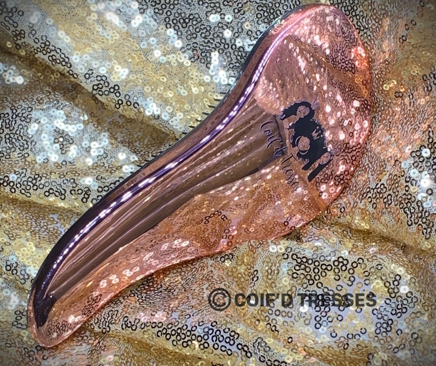 COIF'D DETANGLER BRUSH. THIS IS A GREAT WET BRUSH FOR DETANGLING HAIR AND STYLING HAIR AS WELL.